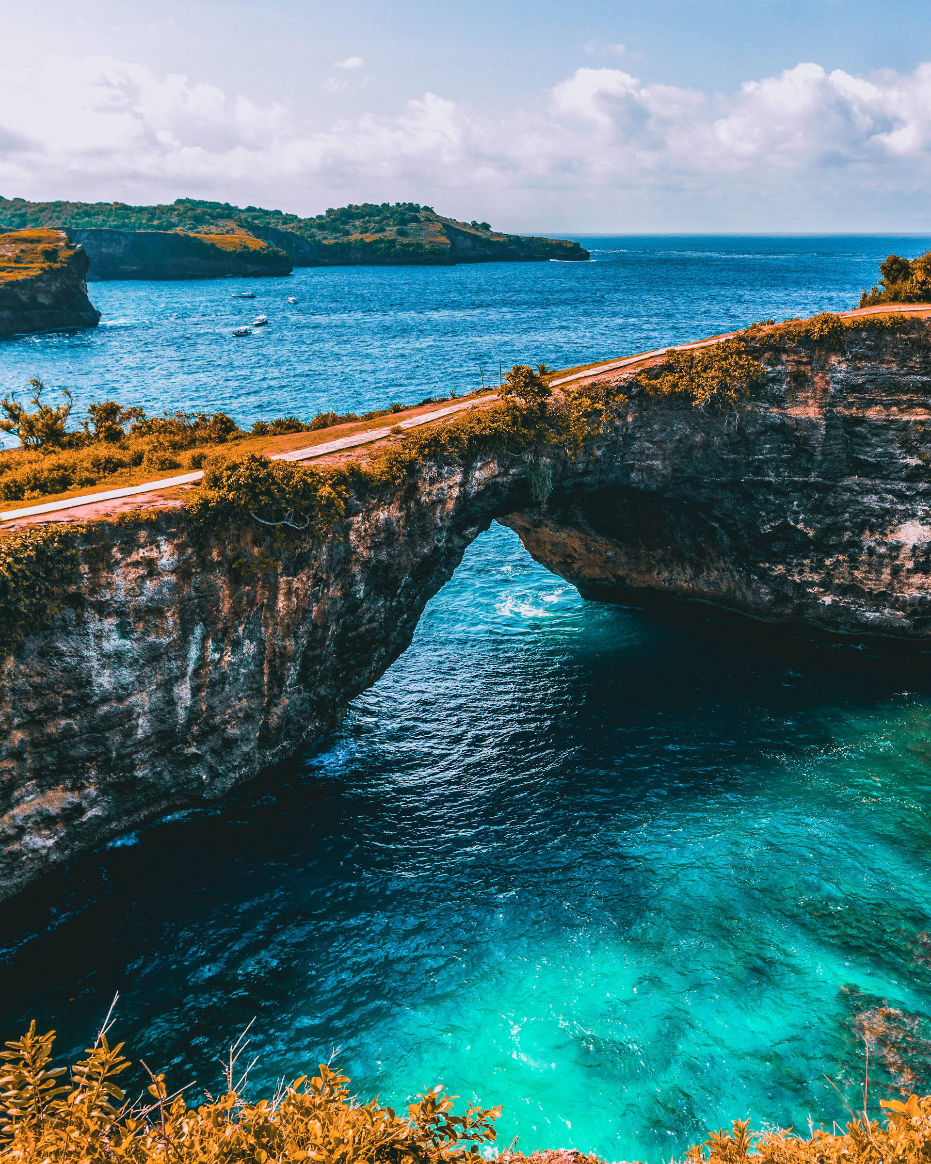 brown and gray bridge at middle of sea