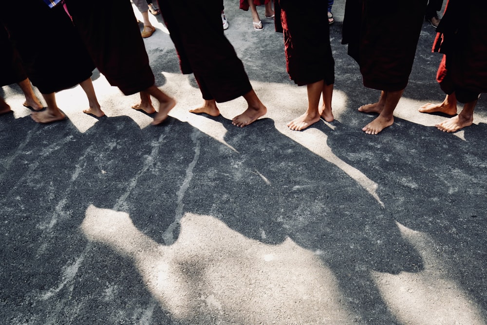 group of people standing at concrete ground