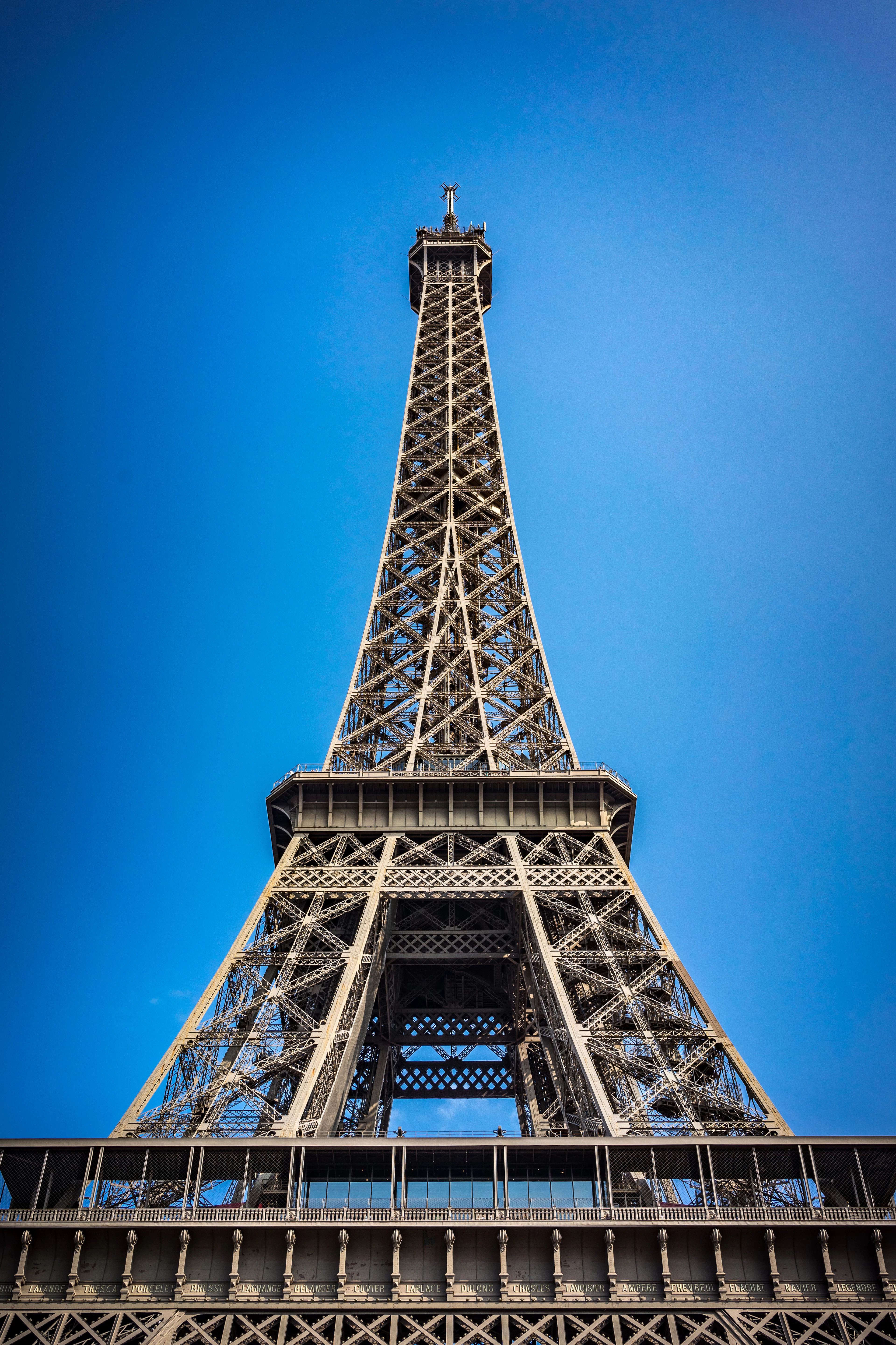 The Eiffel Tower against a blue sky