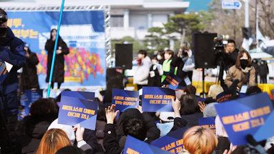 A government event with simultaneous interpreters providing live translation.