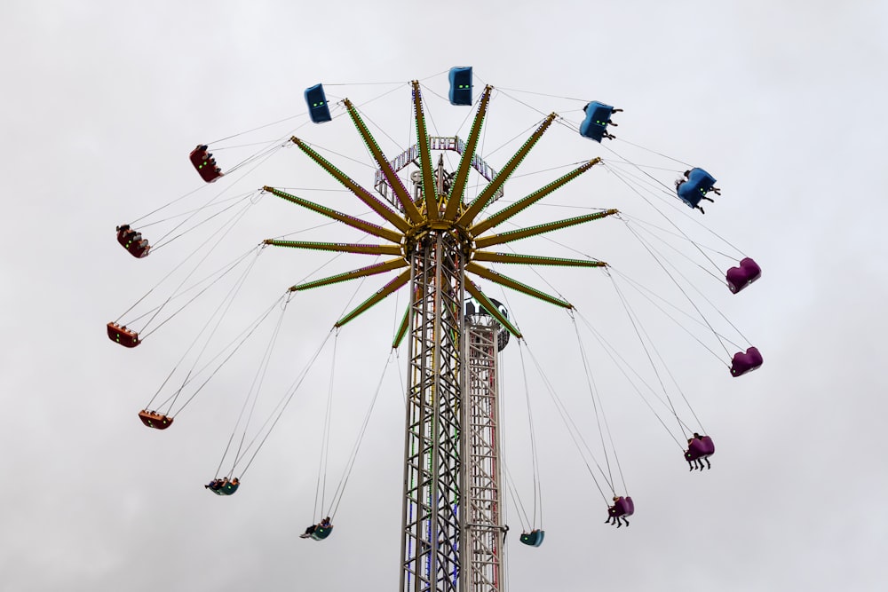 people rides on fun ride low angle photo