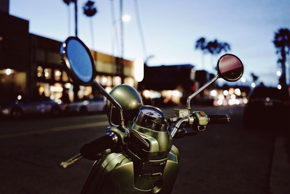 green motor scooter in close-up photography