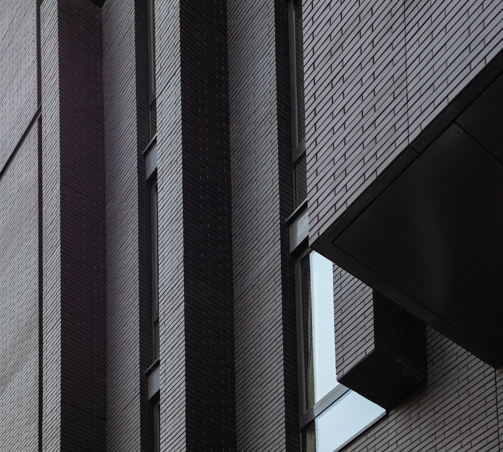 a close up of a clock on the side of a building