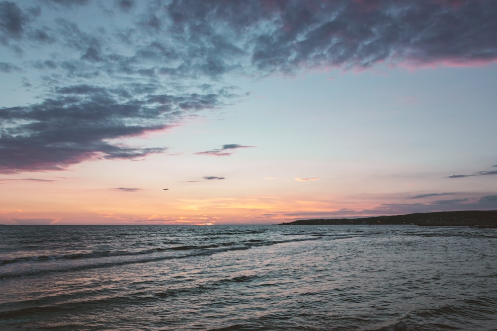 body of water during blue hour