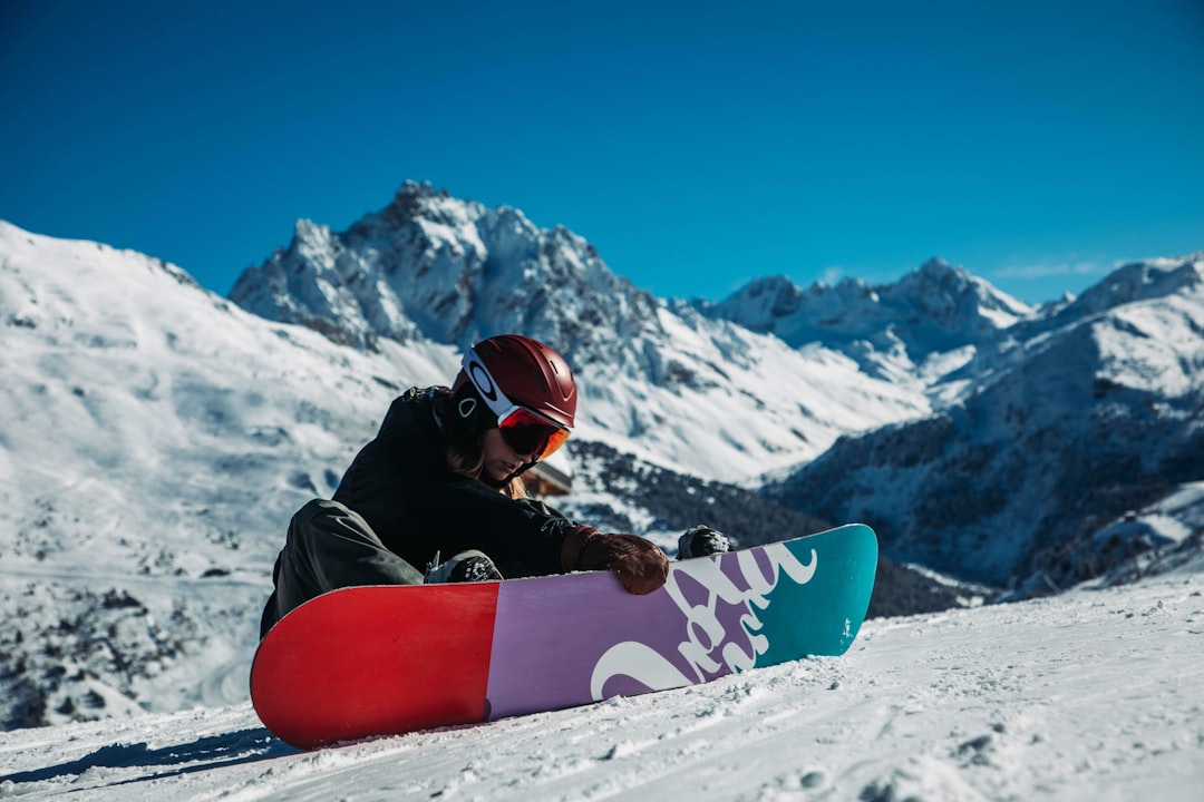 man with ice skis in an icy mountain