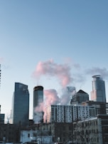 Before-and-after shots of a city skyline, showing smog replaced by clear blue skies.