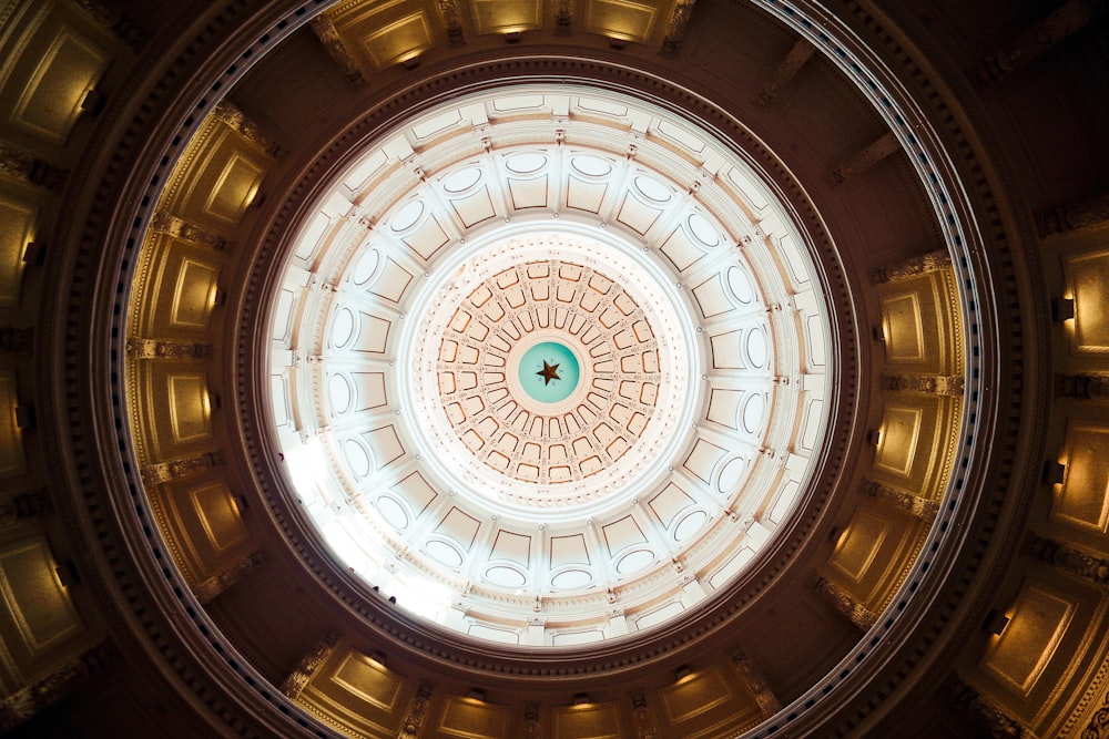 the ceiling of a building with a circular light