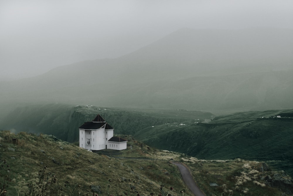 white concrete house near mountain