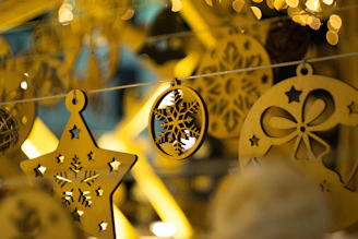 Close-up of a delicate wooden Christmas ornament with intricate hand-painted details, resting on a soft linen cloth.