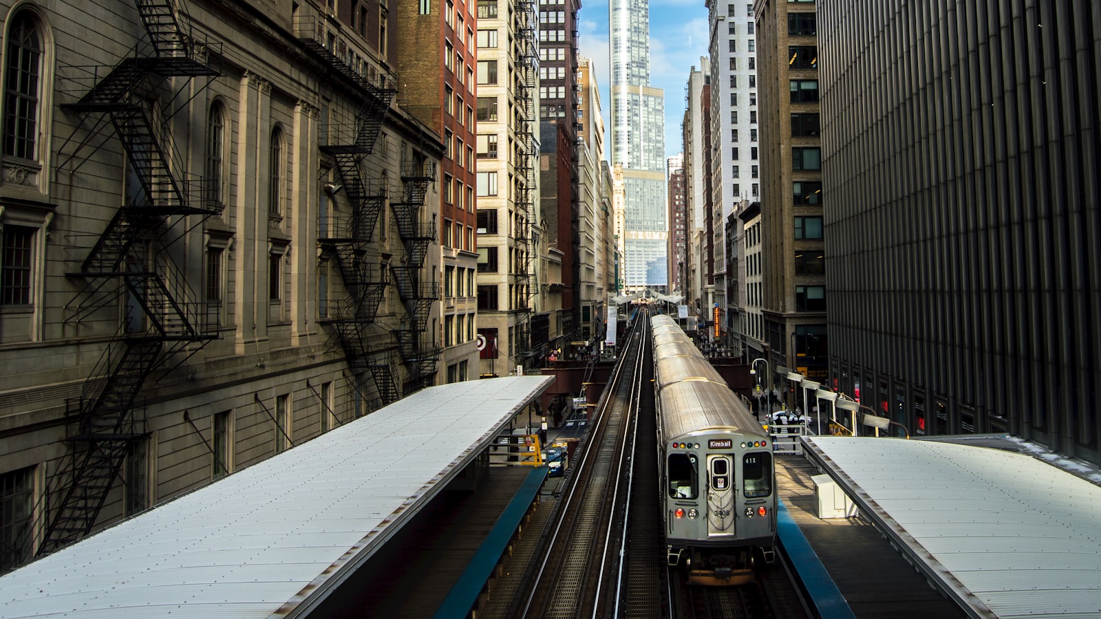 Nikon AF-S DX Nikkor 18-55mm F3.5-5.6G II sample photo. Train surrounded by buildings photography