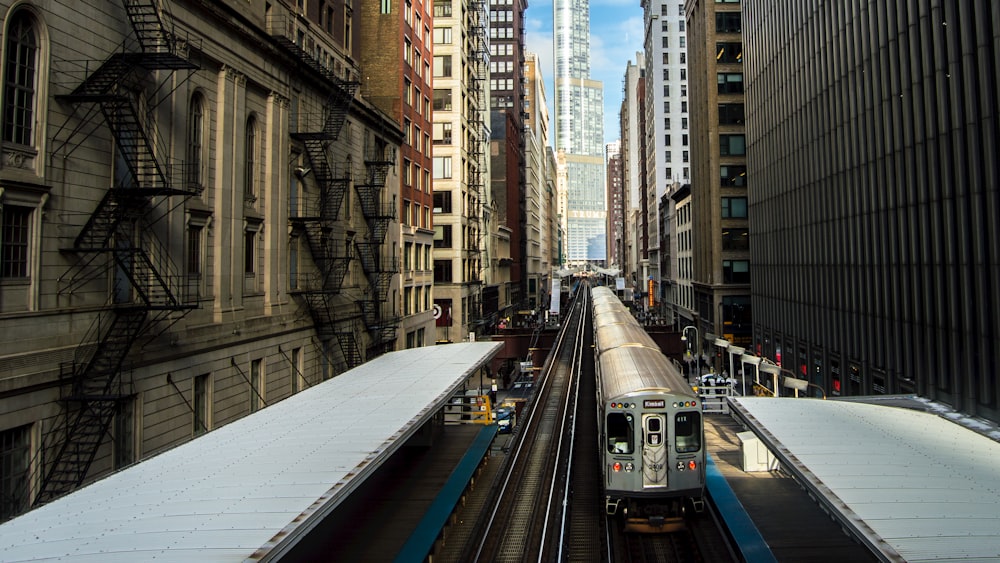 train surrounded by buildings during daytime