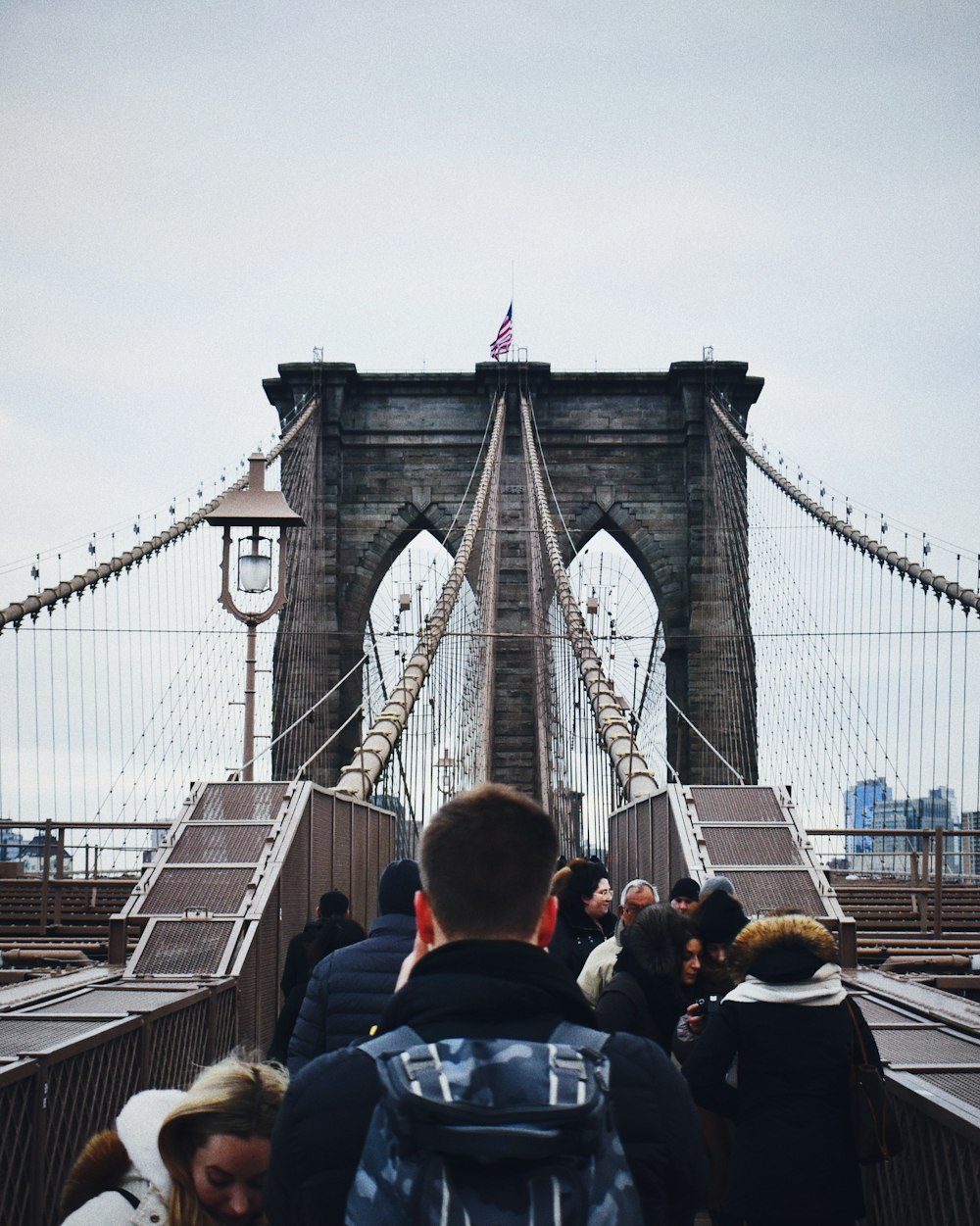 people walking on bridge during daytime