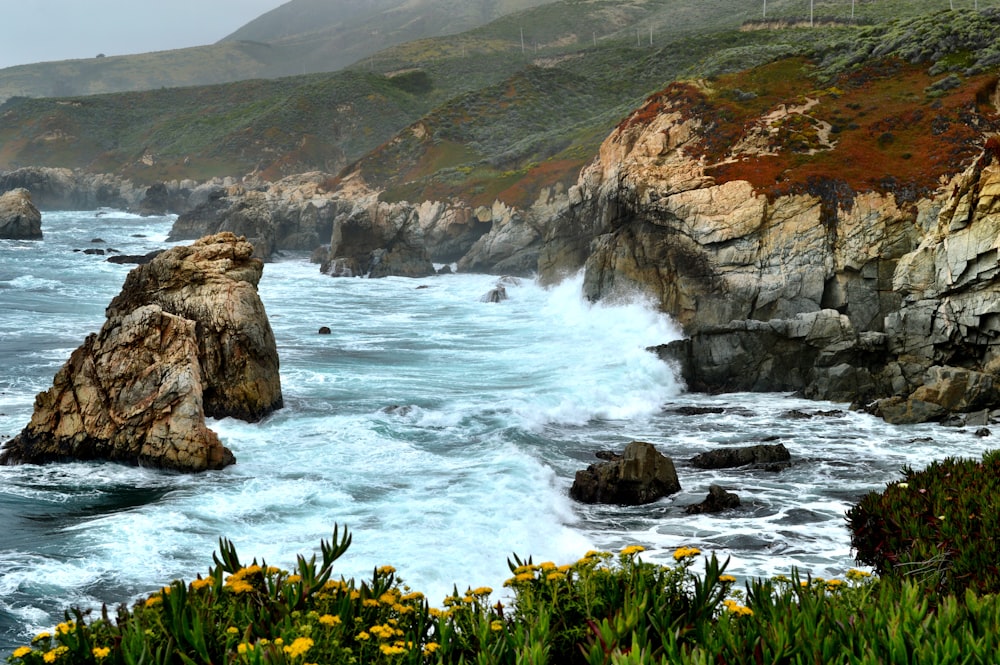 sea waves through boulders