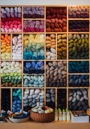 assorted colorful yarn and textile materials