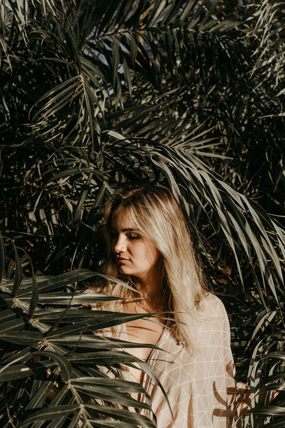 woman standing beside trees