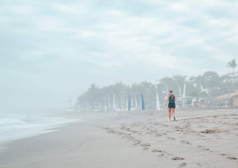 woman running on shore during daytime