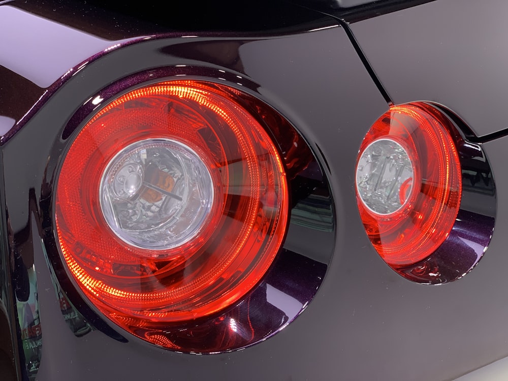 a close up of the tail lights of a sports car