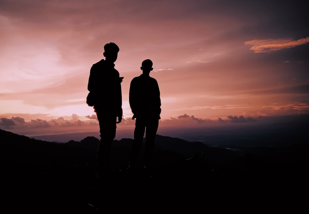 silhouette of two person