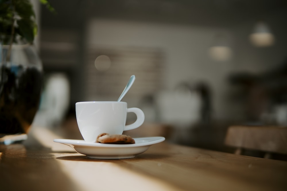 white coffee cup on saucer