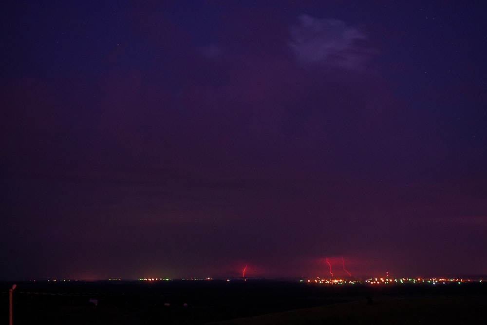 a view of a city at night from a distance