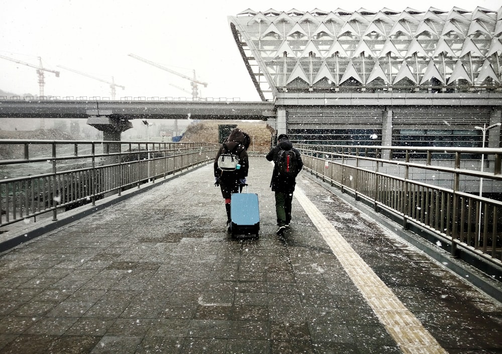 two people walking along pathway