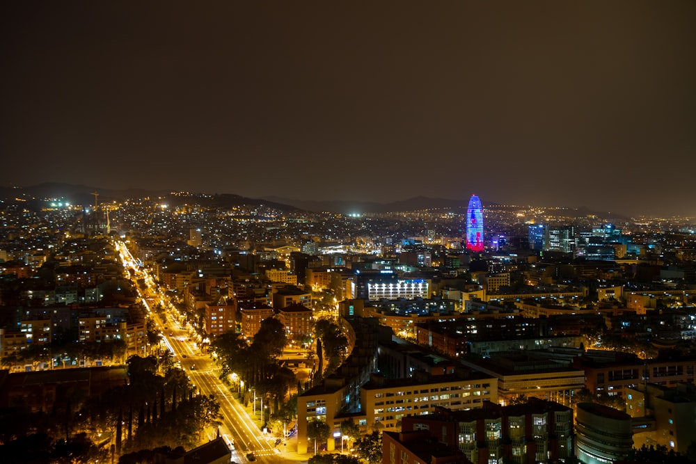 aerial photo of lighted city buildings