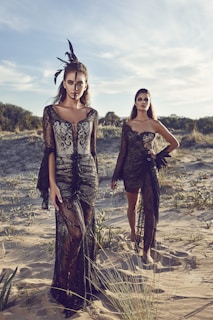 women wearing black lace dresses in dessert