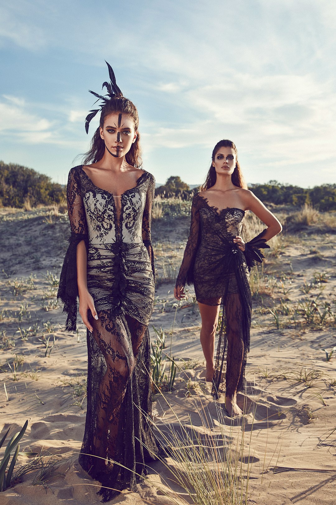 women wearing black lace dresses in dessert