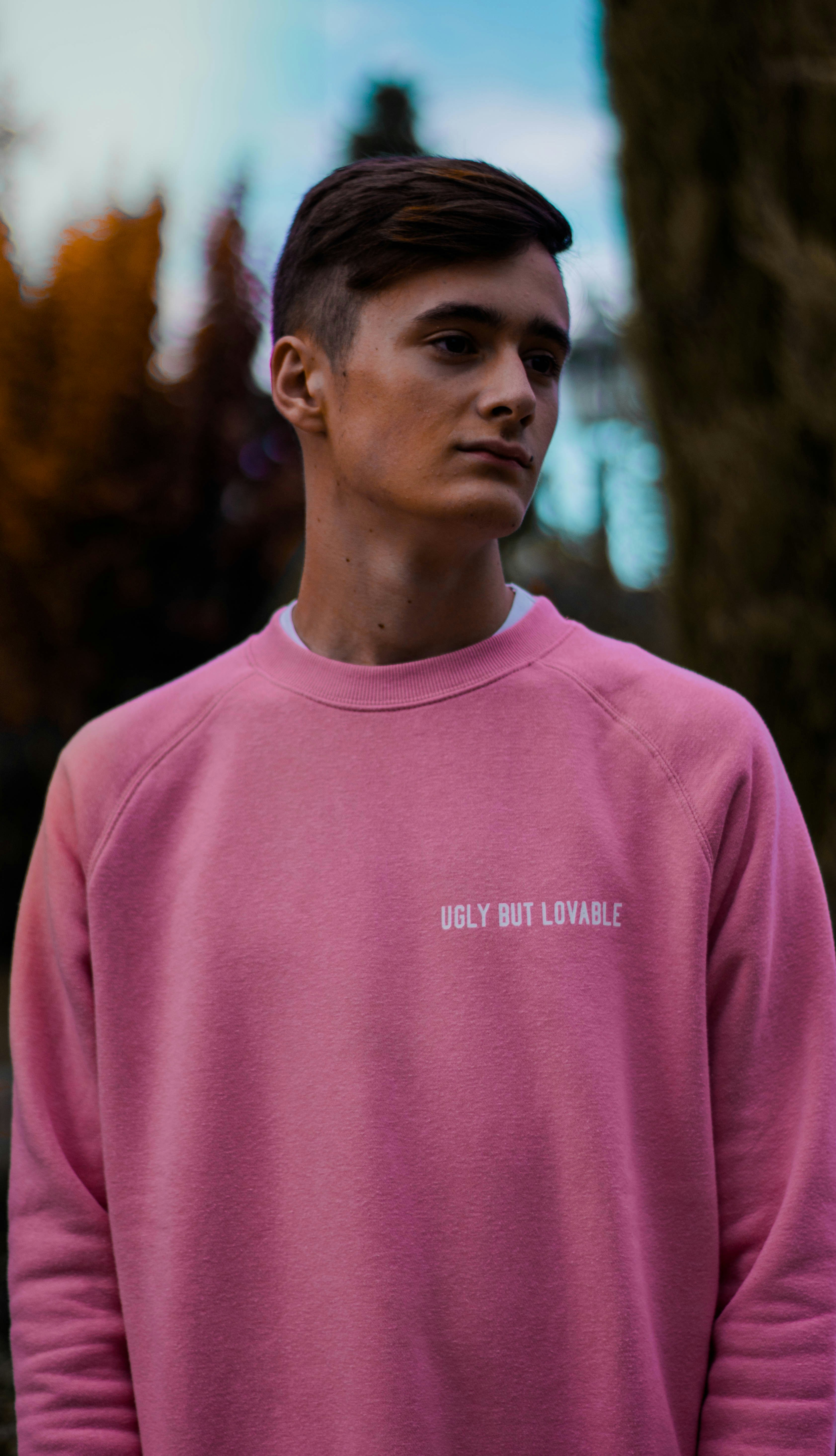 man wearing pink top