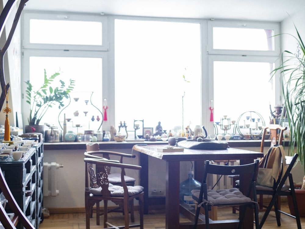 empty wooden chairs near window