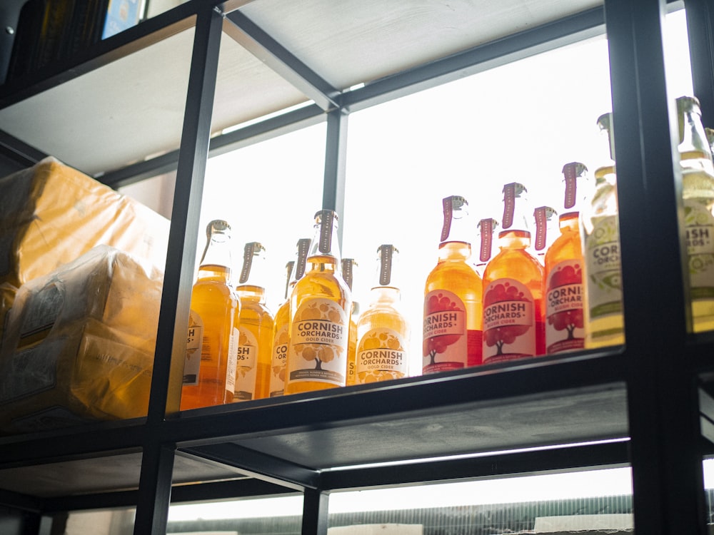 assorted-labeled bottle lot on rack