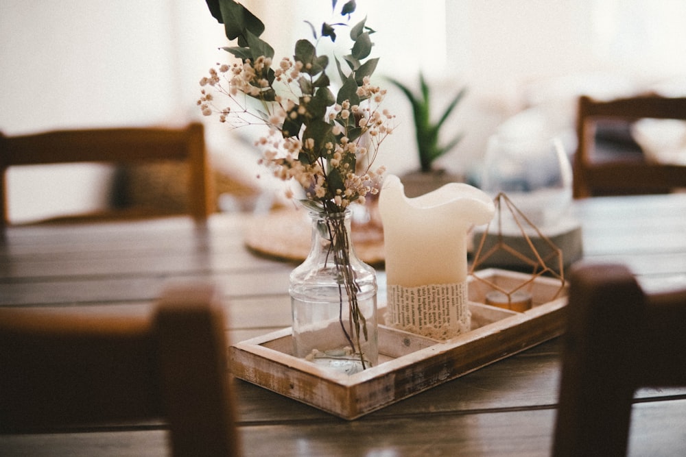 white and white flower on tray