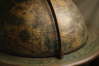 Global map highlighting key trading routes across continents with muted gold accents.
