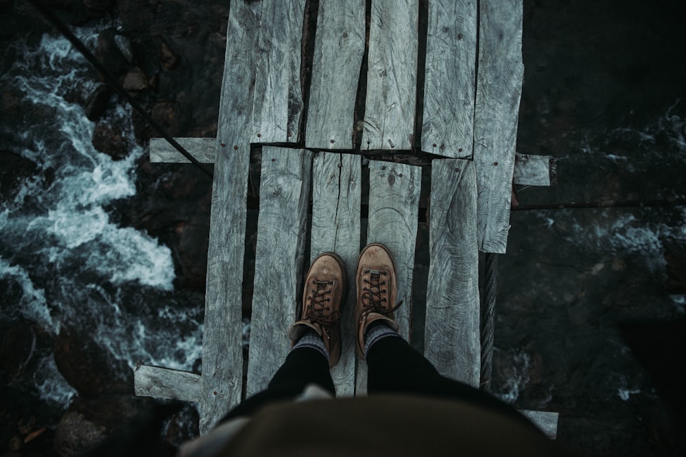 person standing on plank