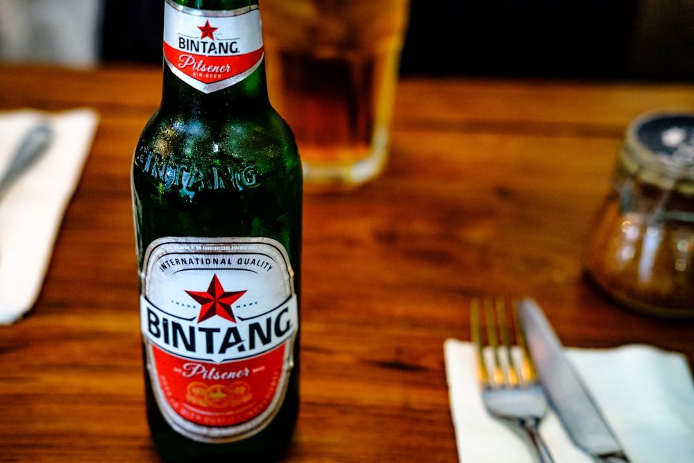 selective focus photography of Bintang bottle