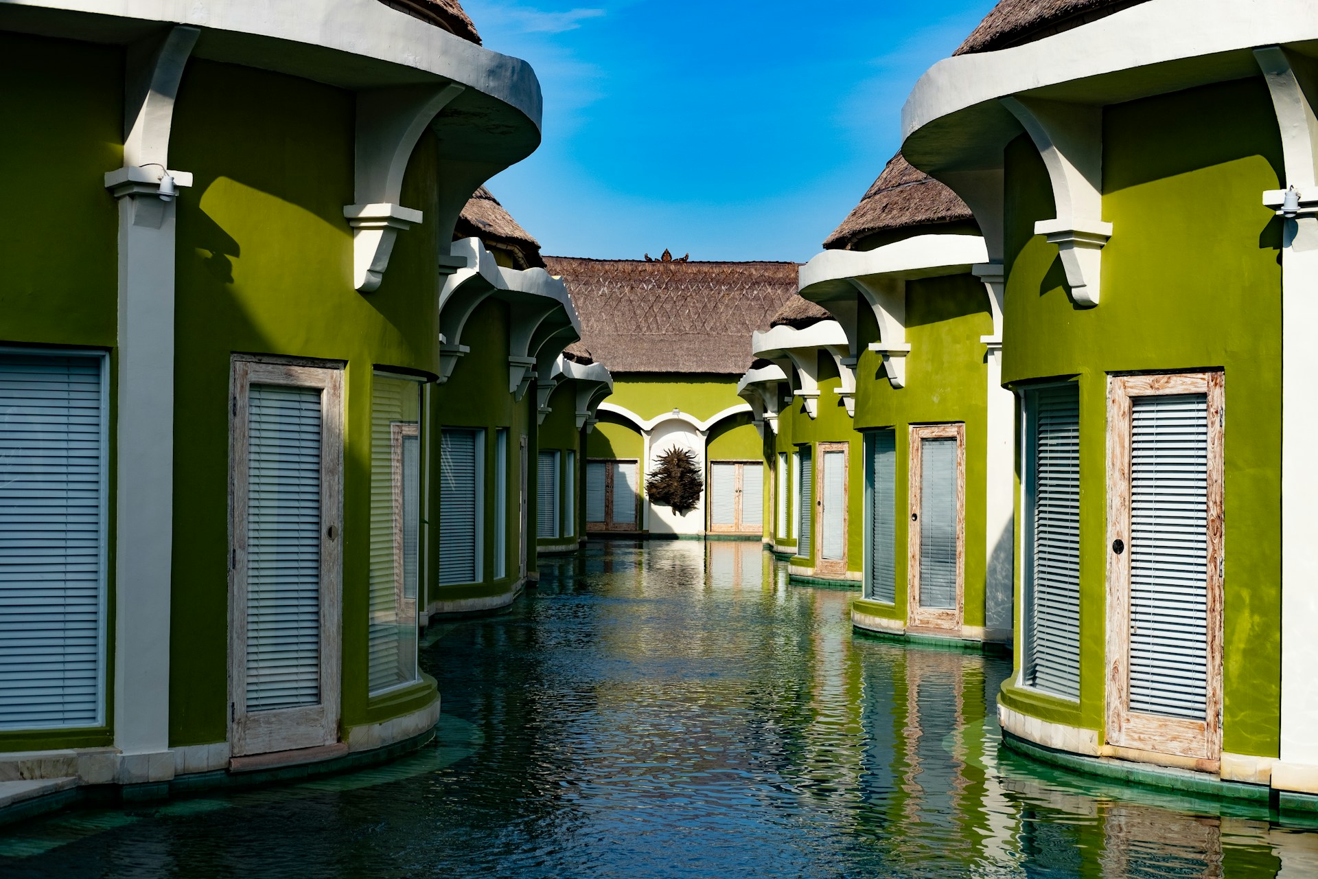 woman wearing yellow long-sleeved dress under white clouds and blue sky during daytime