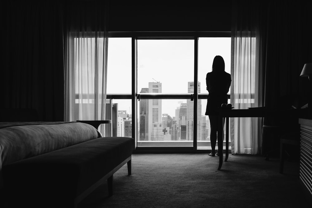 silhouette of woman standing on veranda