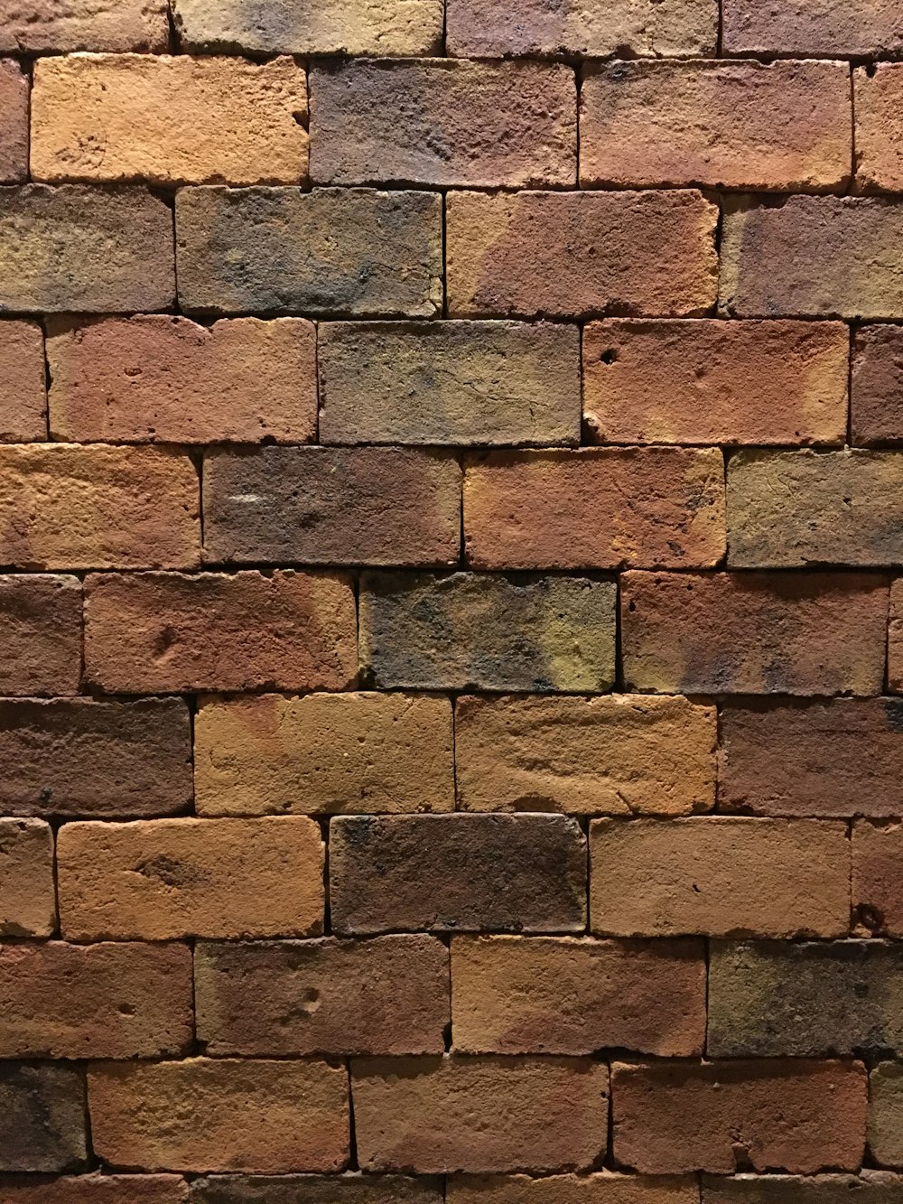 a close up of a red brick wall