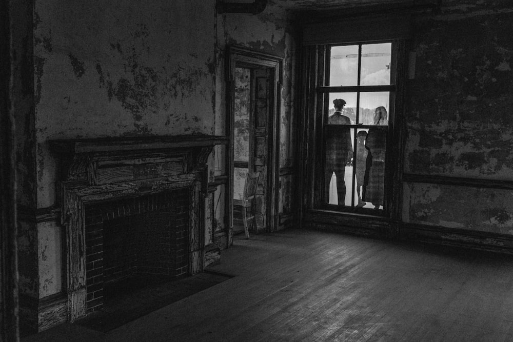 three person standing outside closed door