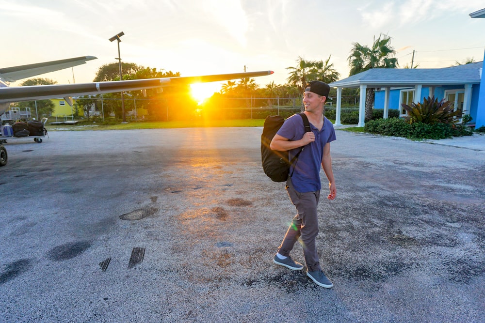 smiling man walking while looking side view