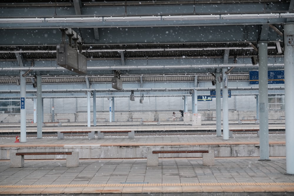 white and brown train station waiting area