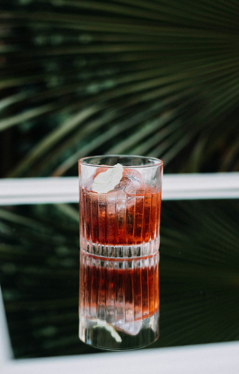 clear glass cup with brown liquid