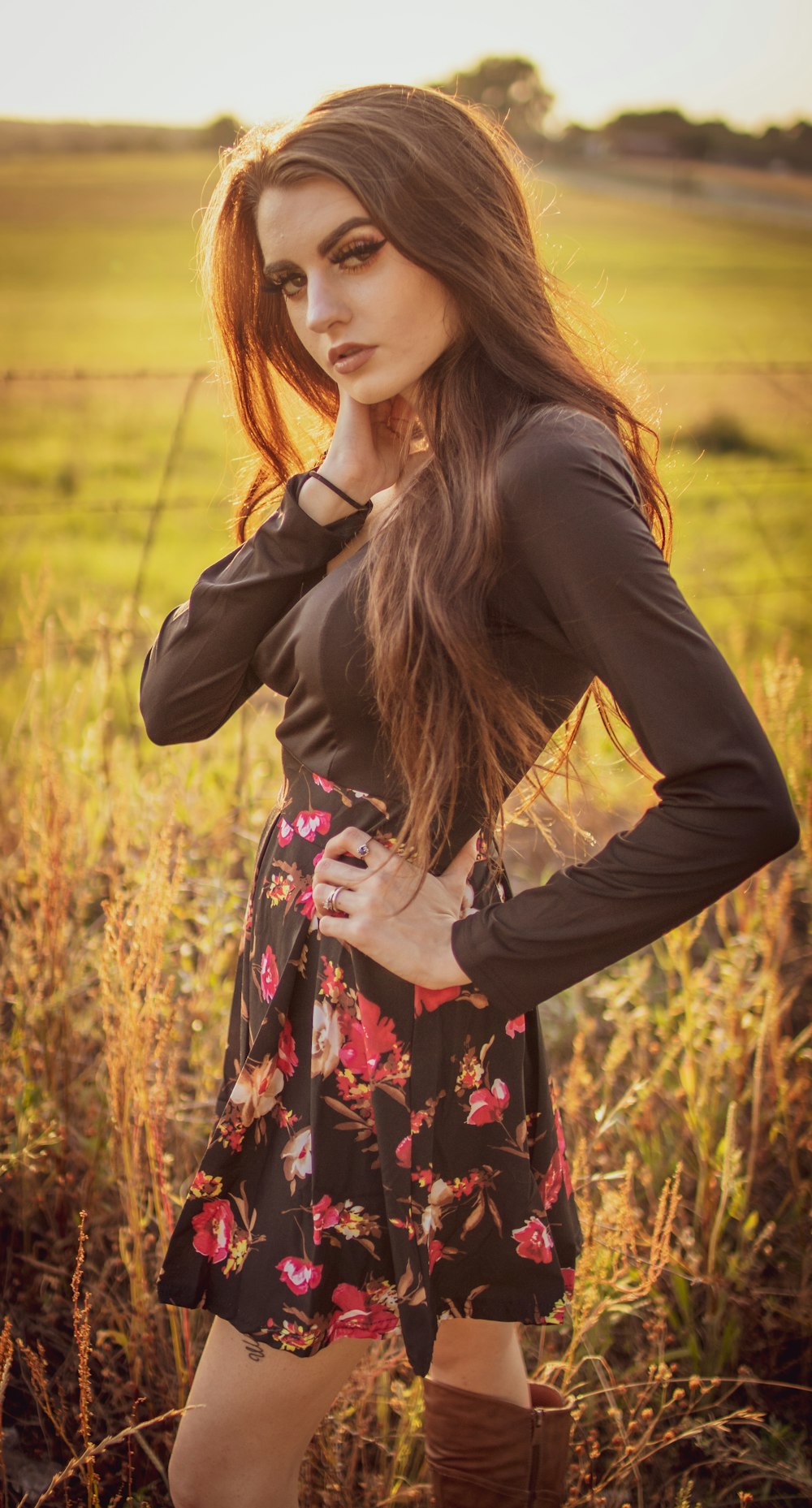 woman standing on green grass field