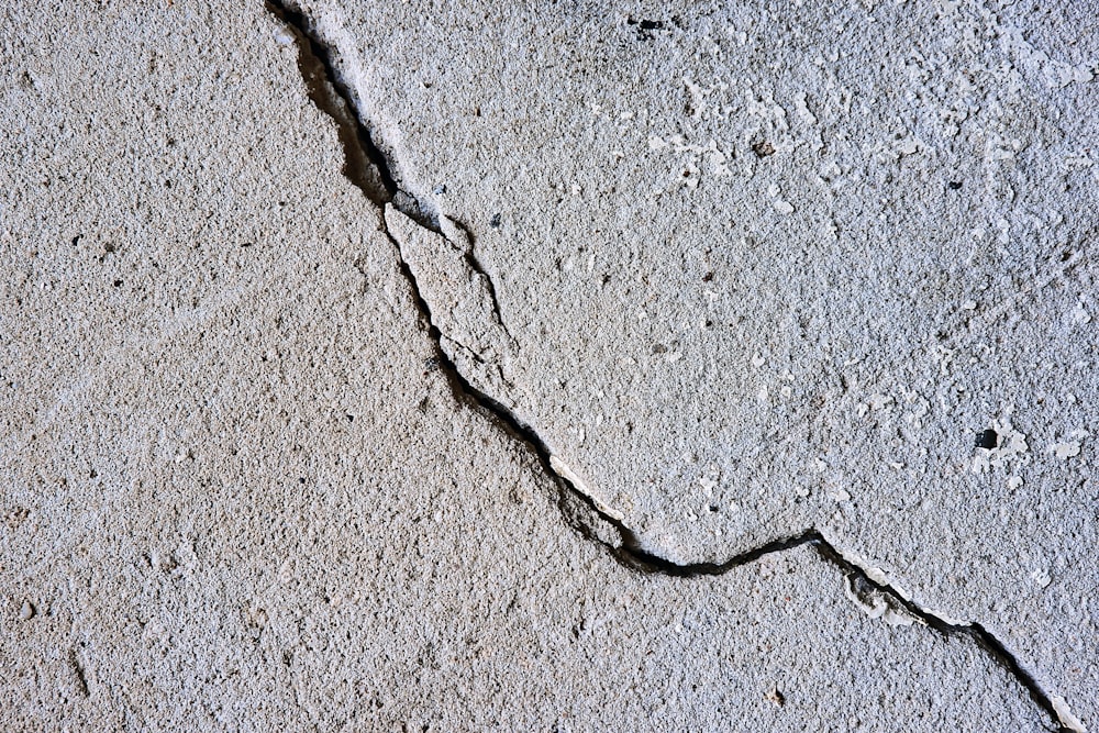 cracked gray concrete surface