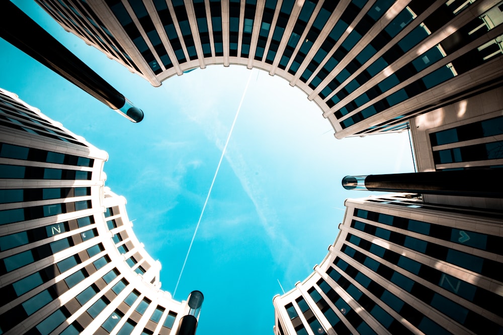 low-angle photography of curtain wall high rise building during daytime