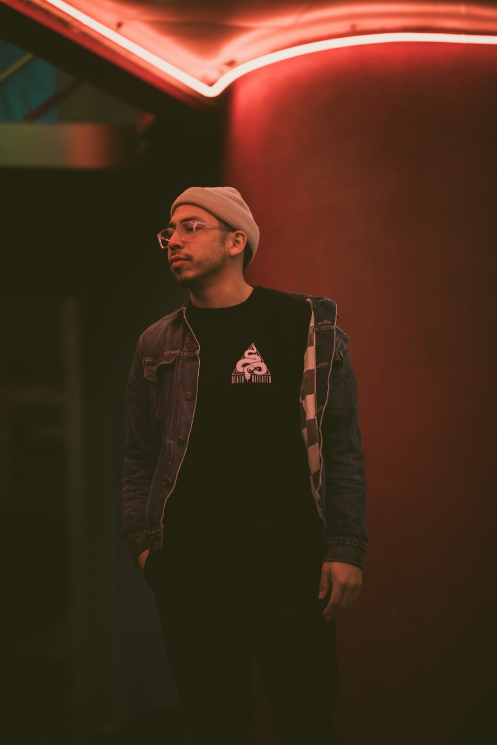 man wearing gray denim jacket