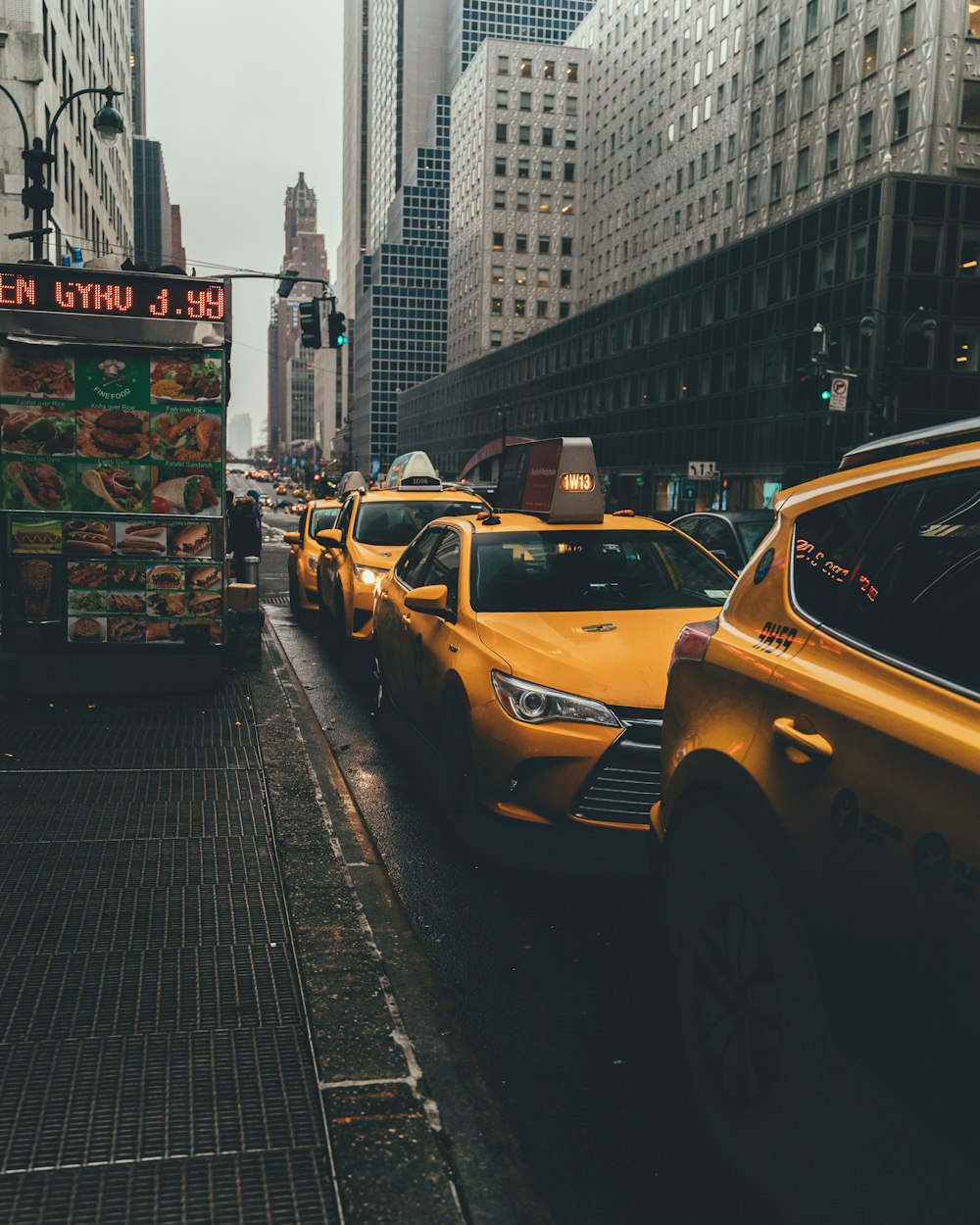 taxis on road during daytime