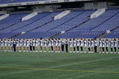 Athletes wearing robust, hand-crafted metal-inspired team uniforms in action.