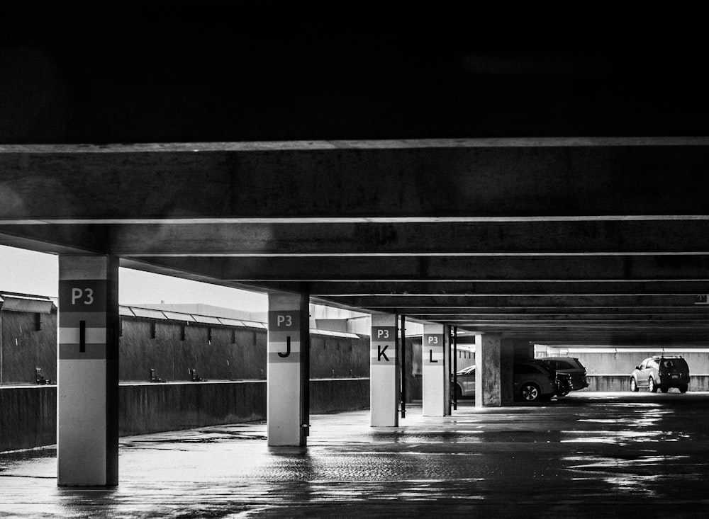 grayscale photo of parking area
