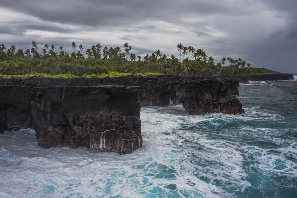 brown and green island under dark sky